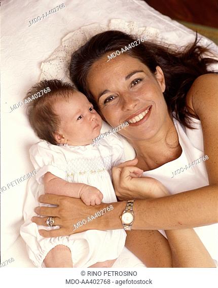 Cristina Parodi posing with her daughter Benedetta. Italian journalist and TV presenter Cristina Parodi posing smiling with her newborn daughter Benedetta Gori