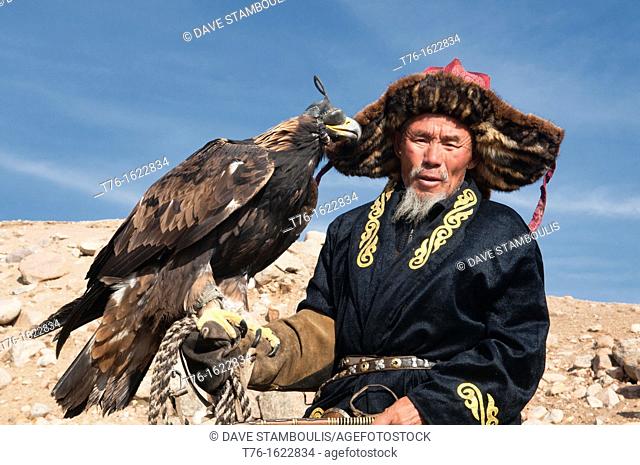 Kazakh eagle hunter and his golden eagle in the Altai Region of Bayan-Ölgii in Western Mongolia