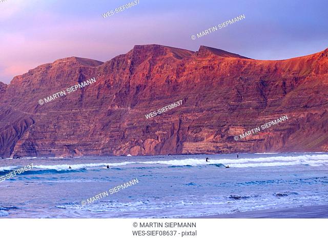 Spain, Canary Islands, Lanzarote, Caleta de Famara, Risco de Famara in the evening light