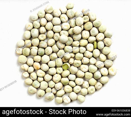 top view of pile of dried whole green peas close up on gray ceramic plate