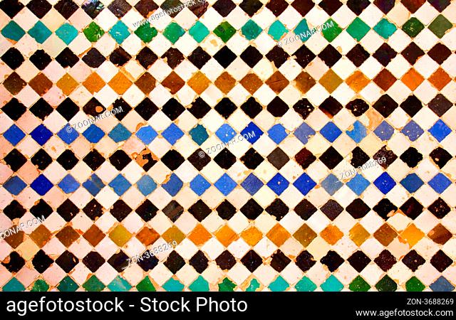 ancient mosaic pattern at the Alhambra, Nazaries Palace, Granada, Spain