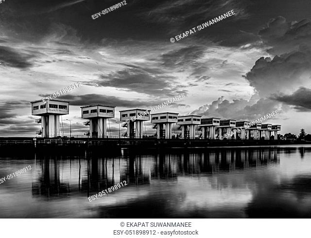Water barrier with cloud sky sunset or sunrise and river long exposure style in twilight, Black and white and monochrome style