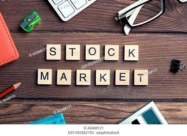 Business workplace and stock market phrase spelled with game elements