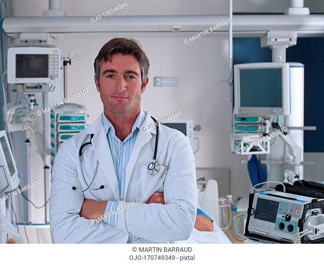 Doctor standing in hospital intensive care with arm closed
