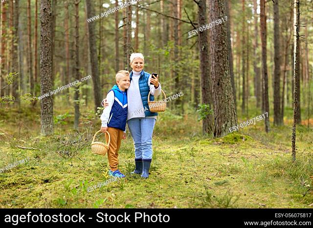 grandmother and grandson with baskets take selfie