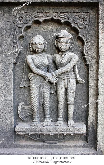 Sculpture of the couple on the outer walls of Shiva temple. Ahilyabai Holkar fort, Maheswar, Khargone, Madhya Pradesh, India