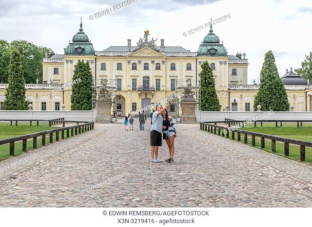 Tourists take a selfie in front of the Branicki Palace in Bialystok, Poland
