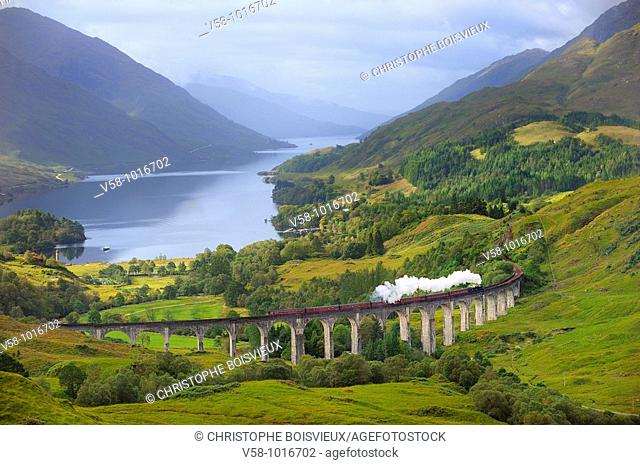 The Jacobite Steam Train, better known now as the Harry Potter Train, crossing the viaduct of Glenfinnan with loch Shiel in the background. Scotland