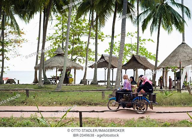 Motorcycle taxi with women on the beach road, Ko Jum or Koh Pu island, Krabi, Thailand, Southeast Asia
