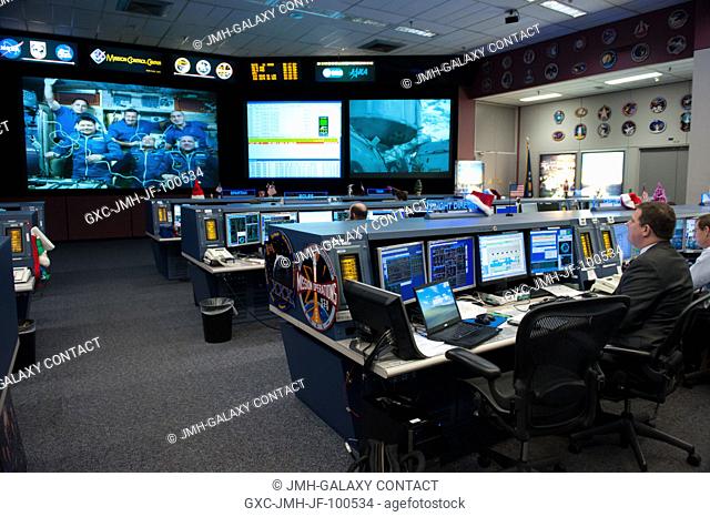 Flight Director Mike Lammers (right), at his console in the space station flight control room of JSC's Mission Control Center