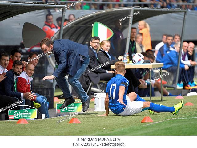 Austria's coach Rubert Marko (l) falls after a collision with Italy's Giuseppe Panico in the match Austria against Italy on the second matchday of the U-19...