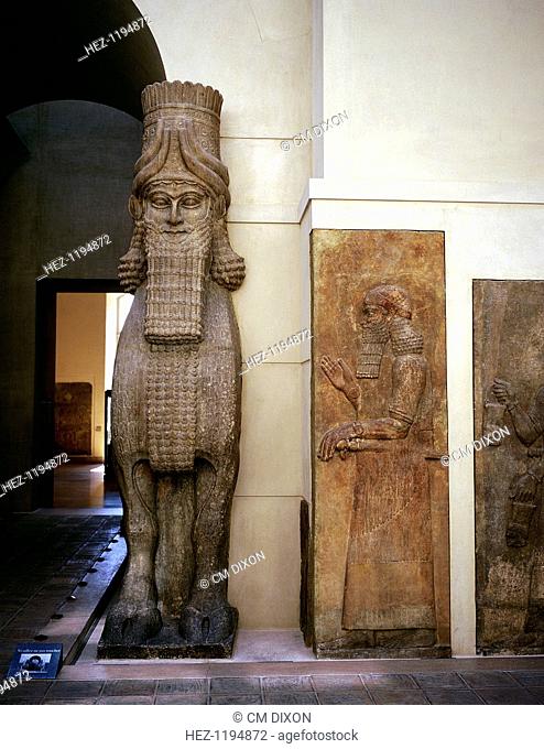 Assyrian sculpture of a human-headed winged bull at the palace gateway, Palace of Sargon II, Khorsabad, 8th century BC. Part of the collection at The Louvre