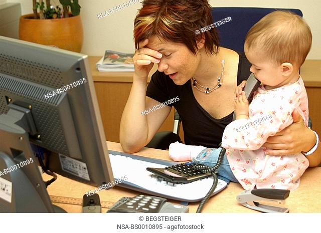overcharged, working mother with child in office