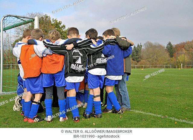 Participants doing their pre-kickoff ritual at a junior soccer tournament, Baden-Wuerttemberg, Germany, Europe