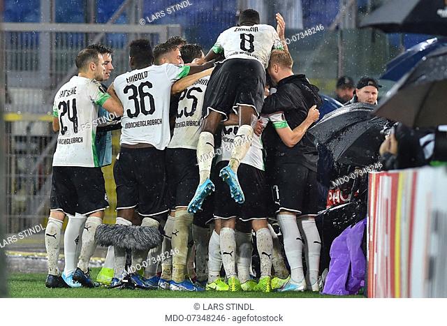 Borussia Monchengladbach football player Lars Stindl rejoices with his team-mates after scoring the goal during the match Roma-Borussia Monchengladbach in the...