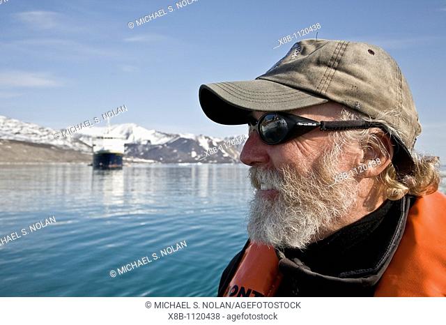 Natural history staff John Fonseca from the Lindblad Expedition ship National Geographic Explorer doing various things in and around the Svalbard Archipelago in...