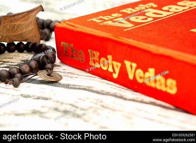Maski, Karnataka, India - March 13, 2019 :The Holy Vedas on wooden texture as a background
