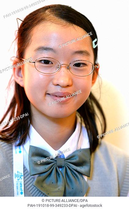 18 October 2019, North Rhine-Westphalia, Cologne: The 12-year-old Japanese Aino Umino stands on the fringes of the first international summit for child-friendly...