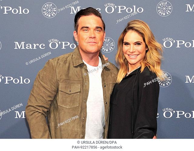 dpatop - British popstar Robbie Williams and his wife Ayda Field Williams arrive at a party held to to celebrate the 50th birthday of Marc O'Polo in Rosenheim