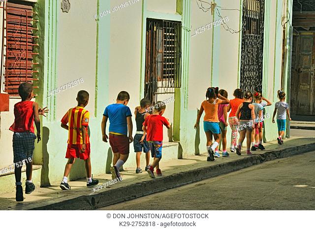 Street photography in Old Havana- First grade schoolchildren, La Habana (Havana), Habana, Cuba