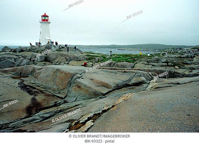 Lighthouse on granite rock in Peggys Cove, Nova Scotia, Canada