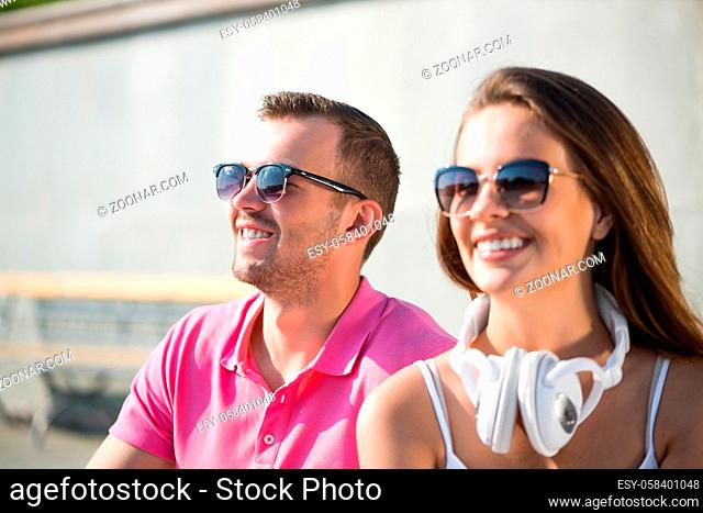 Young happy smiling couple having date outdoors
