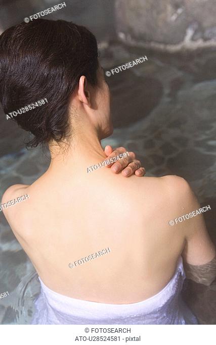 Mature Adult Woman Taking a Hot Spring Bath, Rear View, Head and Shoulder, High Angle View