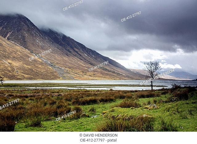 Remote mountains and lake below overcast sky, Loch Etive, Argyll Scotland