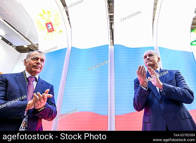 RUSSIA, MOSCOW - DECEMBER 15, 2023: Vladimir Konstantinov (L), Chairman of Crimea's State Council, and Head of Crimea Sergei Aksyonov (R front) applaud Crimea...