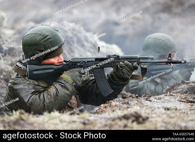 RUSSIA, DONETSK PEOPLE'S REPUBLIC - DECEMBER 11, 2023: A serviceman fires his rifle as team training takes place for combat units of the 9th Motor Rifle Brigade