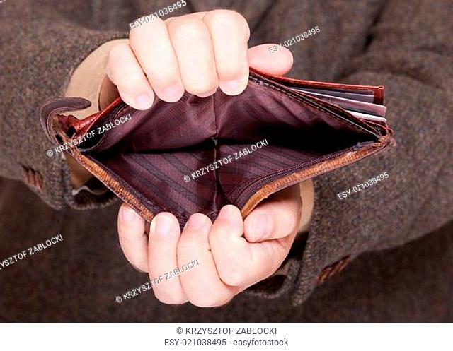 Businessman showing empty wallet. Finance and economy