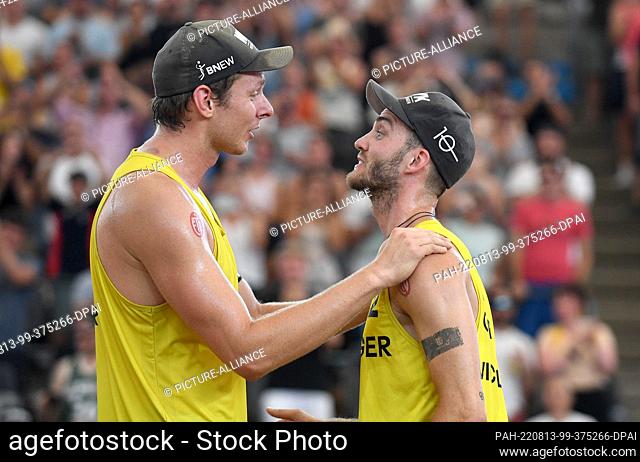 13 August 2022, Hamburg: Beach Volleyball, Beach Pro Tour, August 13, 2022, Stadion am Hamburger Rothenbaum, Nils Ehlers (left) and his partner Clemens Wickler...