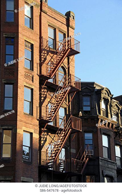Fire escape, late afternoon sun, on a Boston's Back Bay townhouse. USA