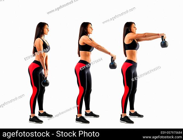 Slender brunette woman doing exhalation with weight on biceps on white isolated background, view from right side, stage of biceps exercise