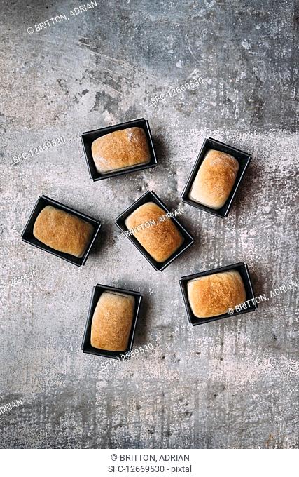 Mini white bread loaves in tins