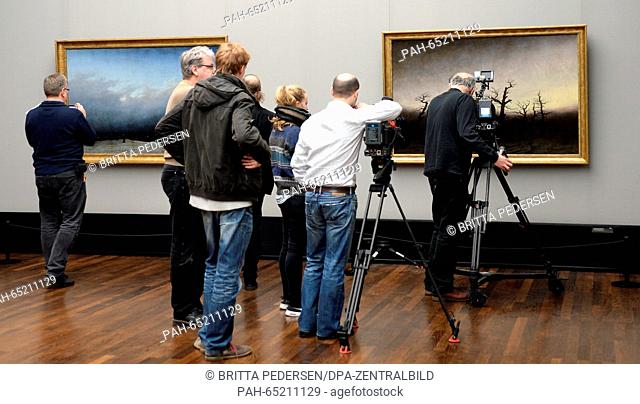 Journalists film the masterpieces 'The Monk by the Sea' (L) and 'The Abbey in the Oakwood' by painter Caspar David Friedrich (1774 - 1840) in the Alte...