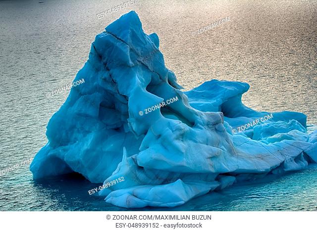 Bergy bit - part of iceberg. Ship sails in immediate vicinity