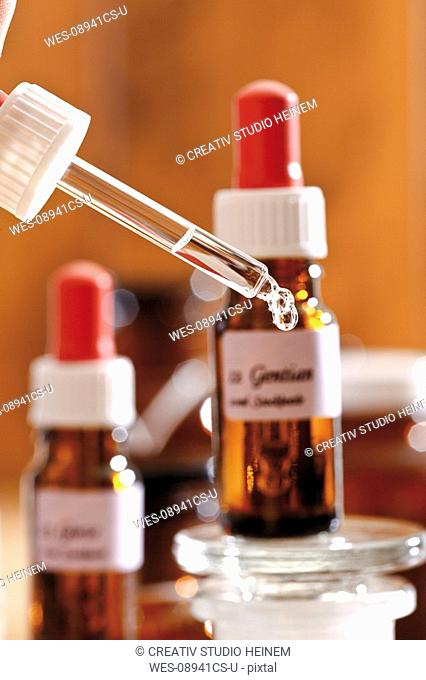 Homeopathic remedies, Drop falling from a pipette, close-up