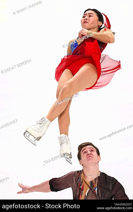RUSSIA, CHELYABINSK - DECEMBER 21, 2023: Pair skaters Maya Shegai and Igor Shamshurov perform a twist lift during a pairs' short programme event as part of the...