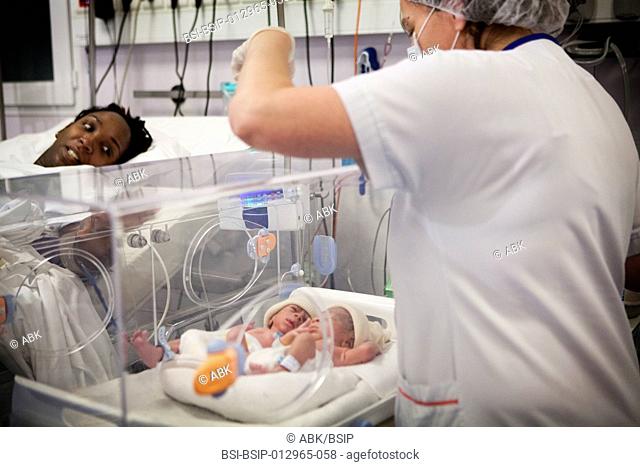 Photo essay at the maternity of Saint Maurice hospital in France. Birth of premature twins. The twins placed in incubator are taken to the labor ward before...
