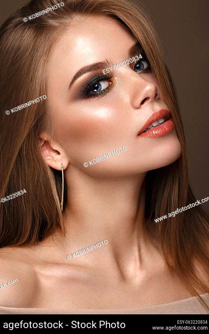 Beautiful girl with classic colorful make up.. Beauty face. Photos shot in studio
