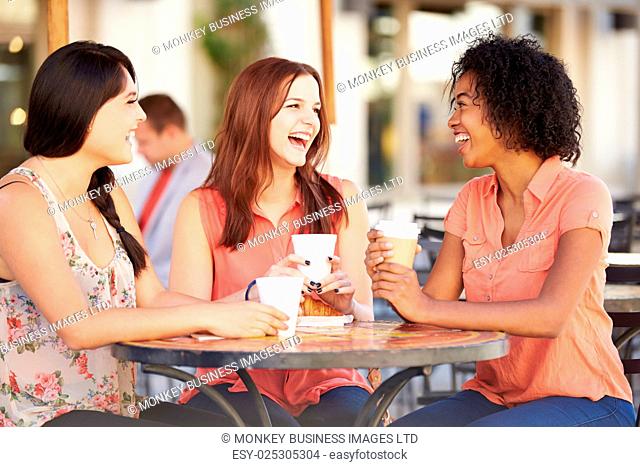 Three Female Friends Meeting In CafÅ½