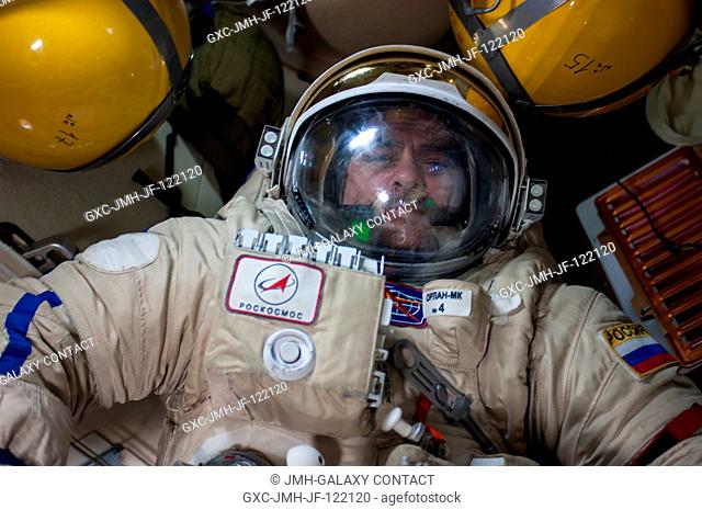 Expedition 35 Russian cosmonaut Pavel Vinogradov, fully equipped with an Orlan EVA suit, participates in a dry run of the first spacewalk of the Expedition 35...