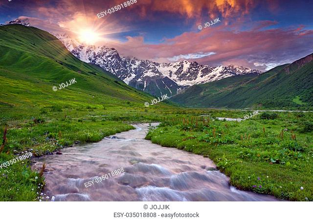 Fantastic sunset at the foot of Mt. Shkhara. Upper Svaneti, Georgia, Europe. Caucasus mountains
