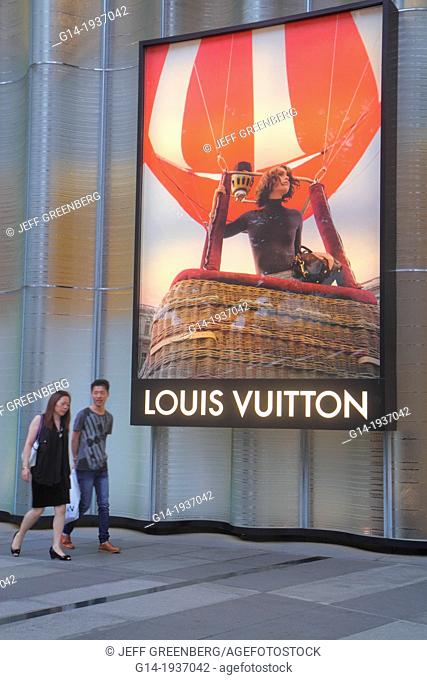 Singapore, Orchard Road, shopping, Asian, woman, man, couple, Louis Vuitton, French fashion designer, sign, billboard, advertising