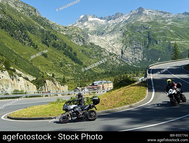 Traffic on the pass road to the Furka Pass near Gletsch, in the background the headwaters of the Rhone in the ice-free steep former ground moraine of the Rhone...
