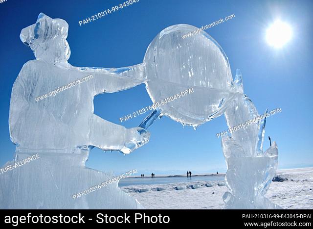 10 March 2021, Russia, Listwjanka: An ice sculpture on Lake Baikal in southeastern Siberia, Russia, melts in the sun. The meter-thick ice of Lake Baikal in...