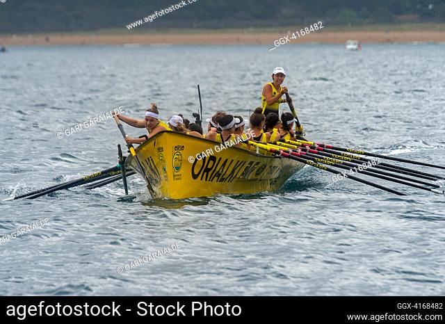 Crew of Orio rowing boat in action during XV Zarauzko Ikurrina women’s regatta of the ACT Euskotren League (The Association of Clubs of rowing boats)