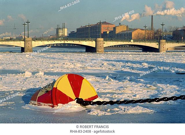 Buoy frozen into ice on the Bol'Shaya Nevka River, a tributary of the Neva, near the Svobody Bridge, St. Petersburg, Russia, Europe