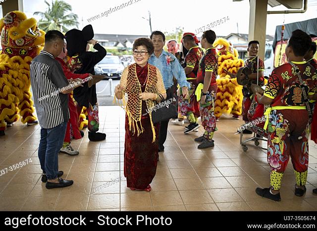 Lion dance to welcome the VIPs arrival for the Chinese New Year dinner at Sungai Maong Community Hall, Kuching, Sarawak, Malaysia